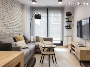 Decorar con ladrillo rústico blanco en un sala de estar de una vivienda