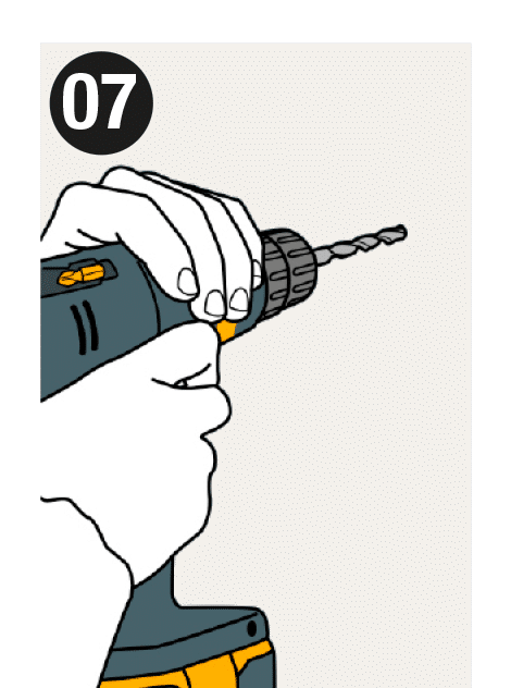 Step 7 of the installation: Take the panel away and drill with a 6 mm bit at the points marked on the wall with the 3 mm bit.